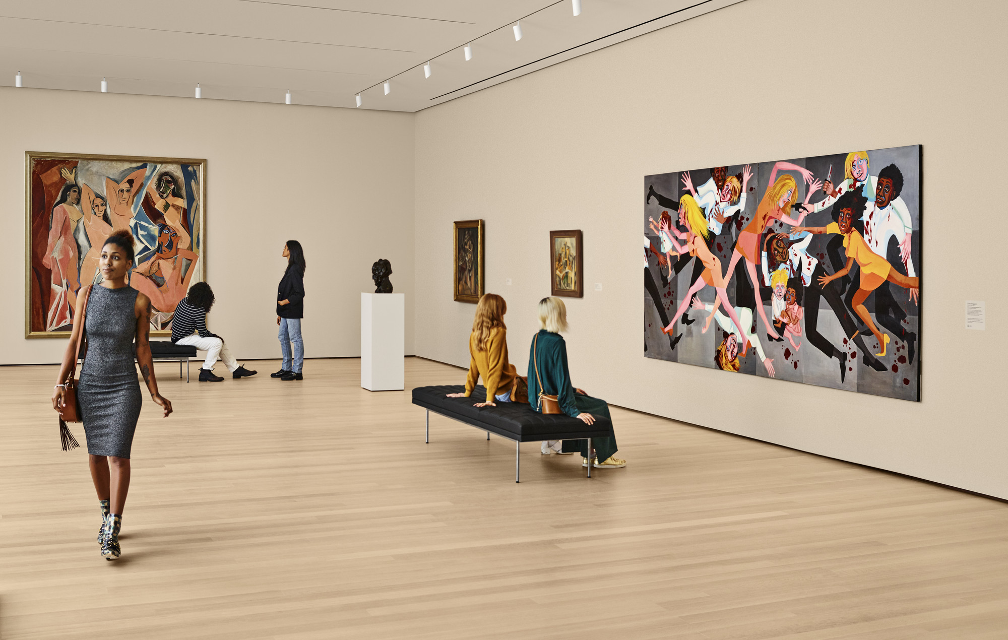 A view of the fifth-floor collection galleries. Shown (from left): Pablo Picasso. Les Demoiselles d’Avignon. 1907. Oil on canvas. Acquired through the Lillie P. Bliss Bequest (by exchange); Pablo Picasso. Woman’s Head (Fernande). 1909. Bronze. Purchase; Pablo Picasso. Woman with Pears. 1909. Oil on canvas. Florene May Schoenborn Bequest; Pablo Picasso. The Reservoir, Horta de Ebro. 1909. Oil on canvas. Gift of Mr. and Mrs. David Rockefeller. All works by Pablo Picasso © 2019 Estate of Pablo Picasso/Artists Rights Society (ARS), New York; Faith Ringgold. American People Series #20: Die. 1967. Oil on canvas, two panels. Acquired through the generosity of The Modern Women’s Fund, Ronnie F. Heyman, Eva and Glenn Dubin, Lonti Ebers, Michael S. Ovitz, Daniel and Brett Sundheim, and Gary and Karen Winnick. Photo: Noah Kalina